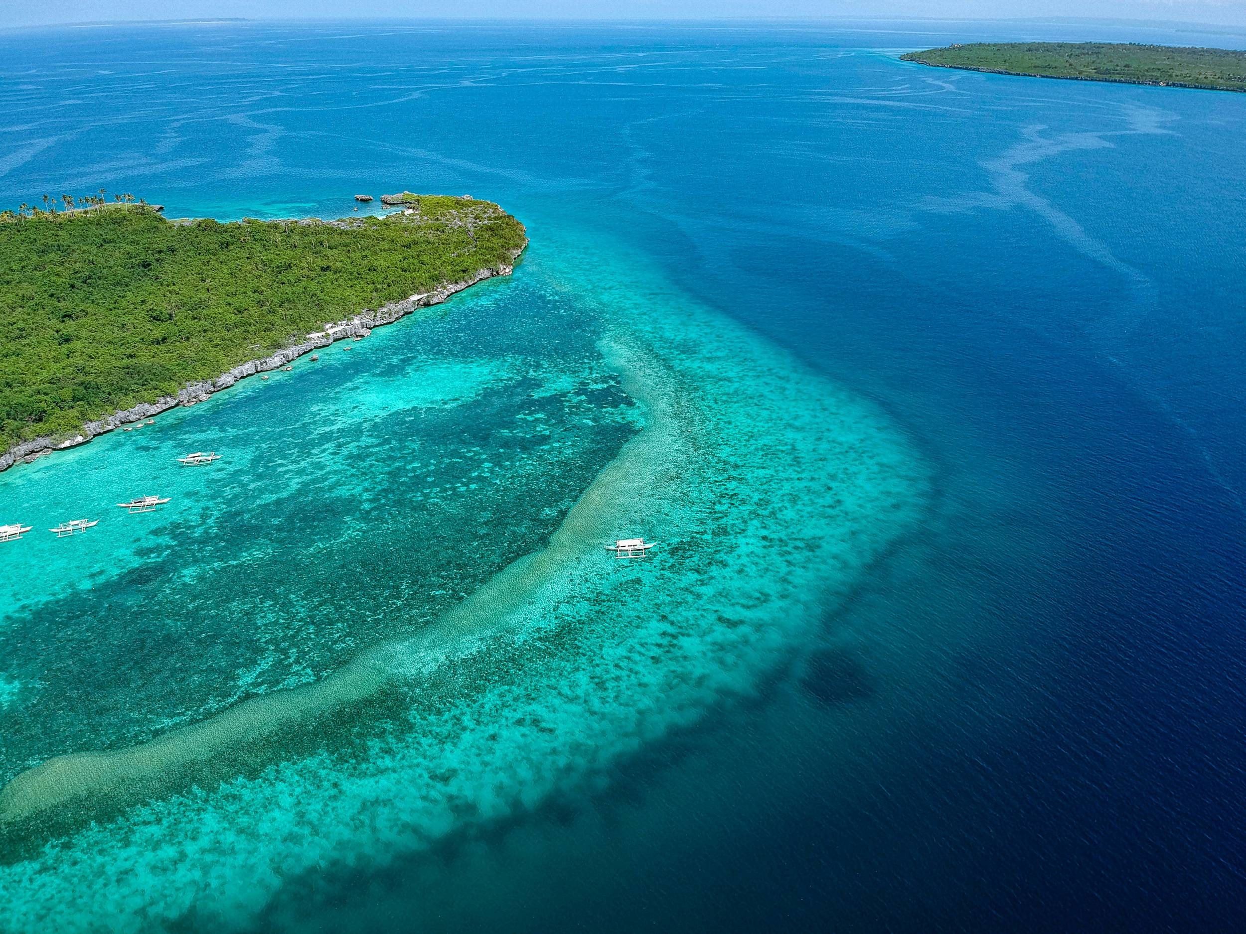 antayan Beach showing green and blue ocean waters in Cebu